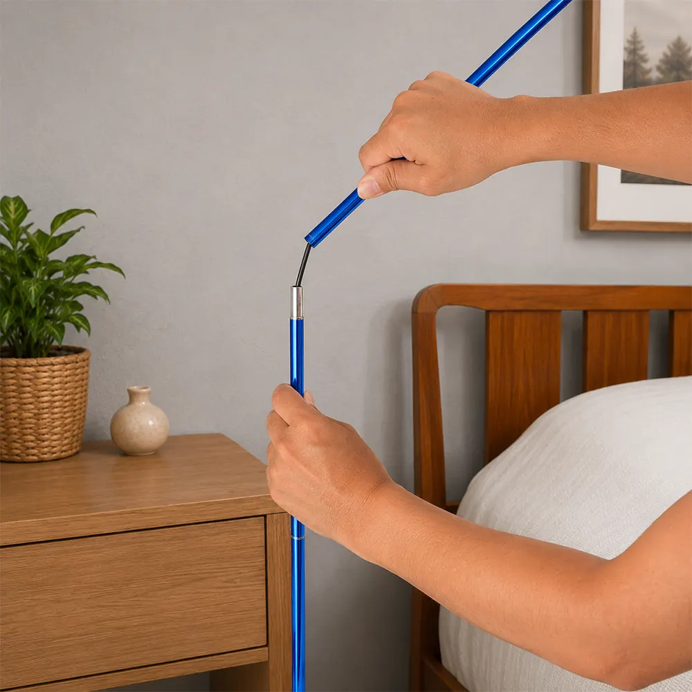Person assembling a blue extendable flexible pole indoors