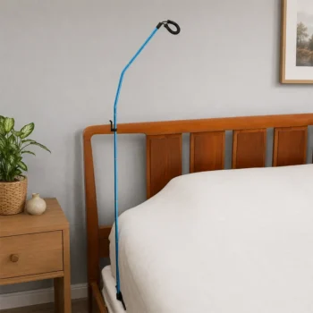 Blue bed assist rail with handle hook on wooden headboard